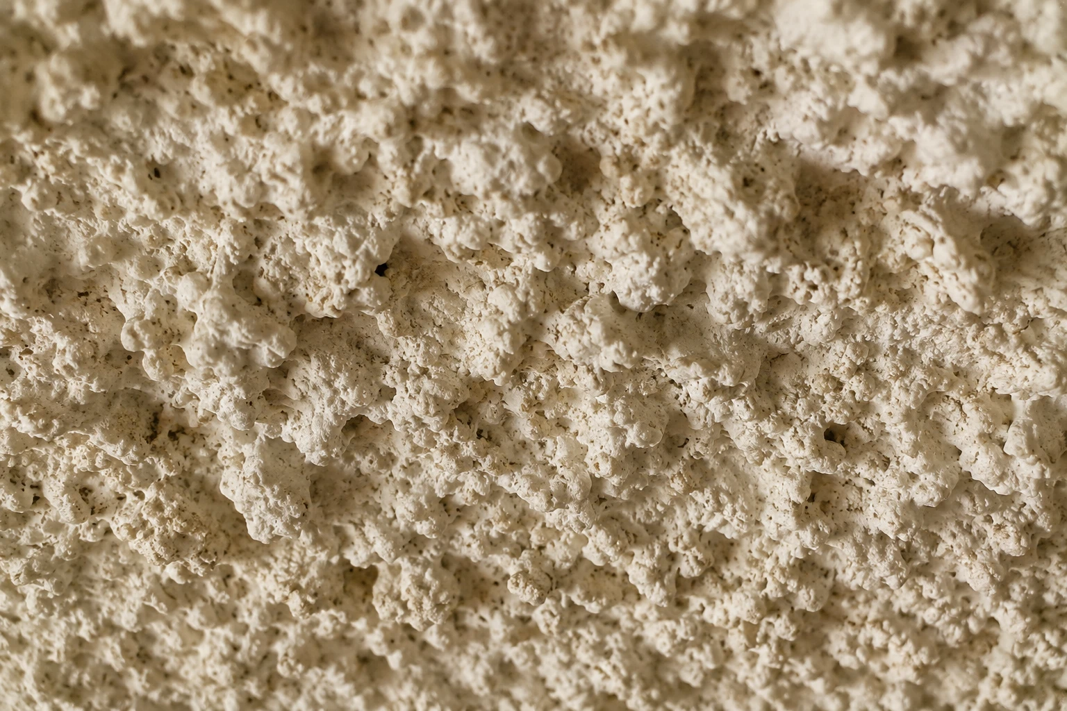 Close-up of old popcorn ceiling texture in Utah home